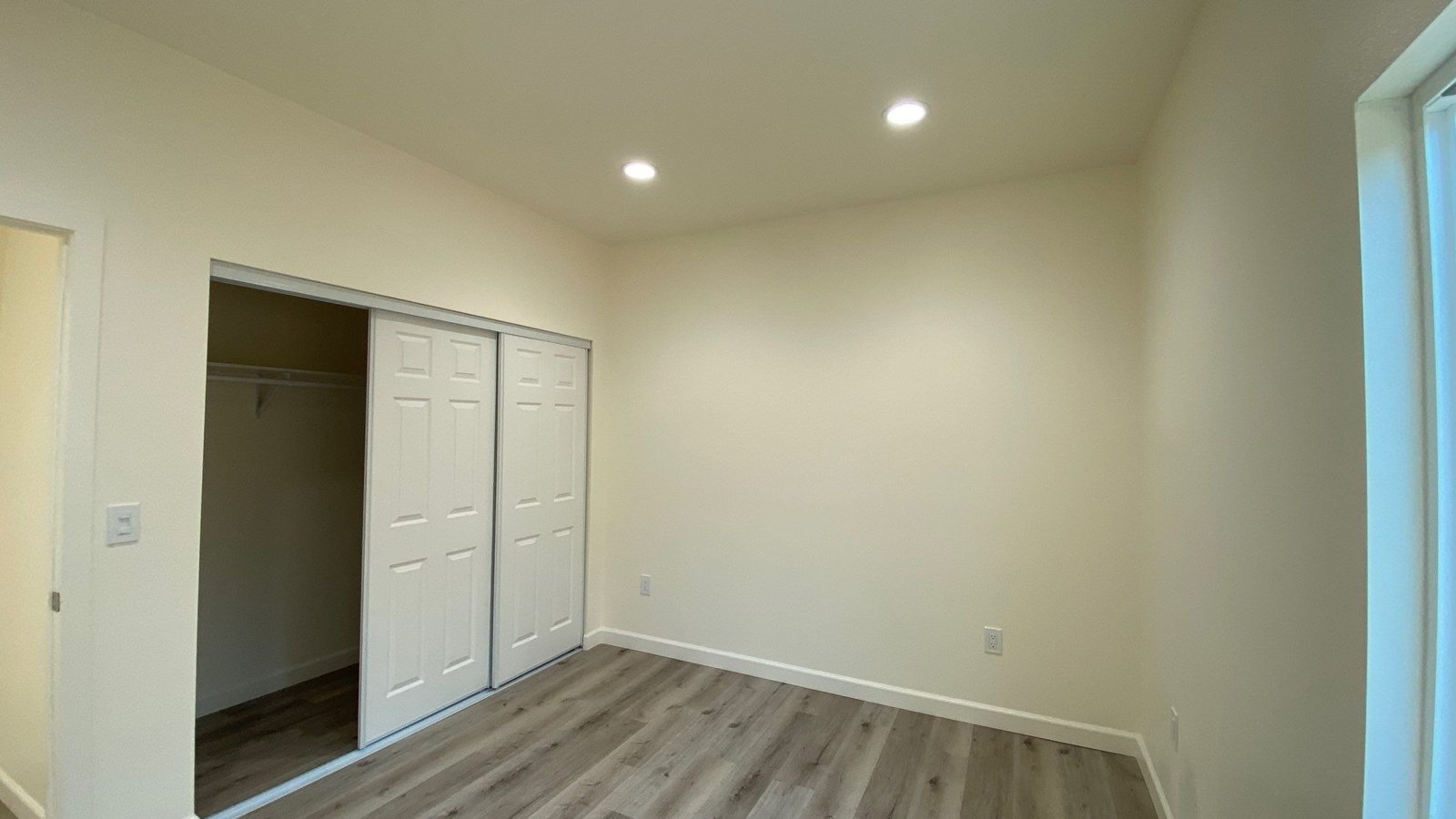 a room with a closet and closet doors