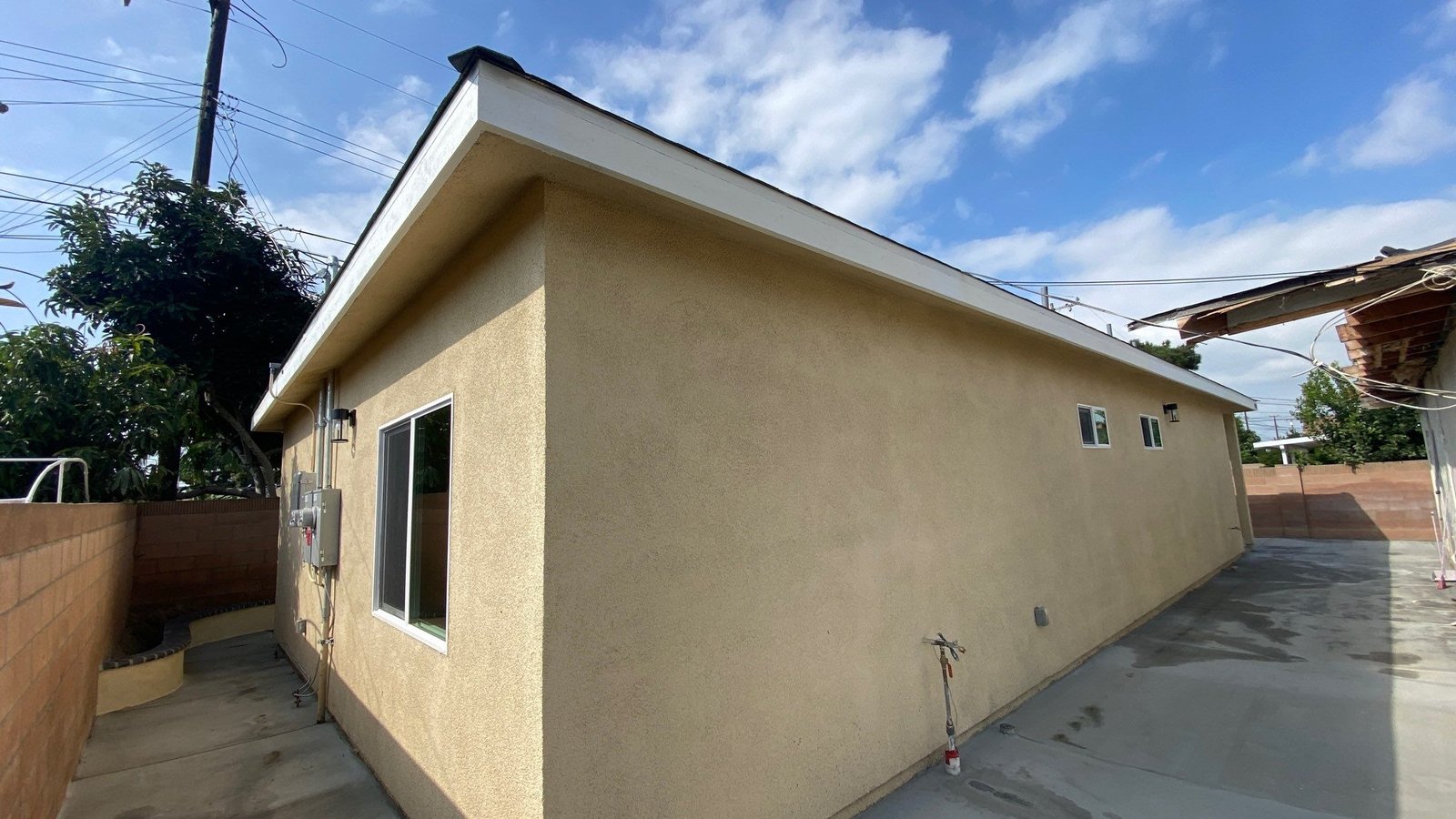 a house with a small yard with a fenced in area